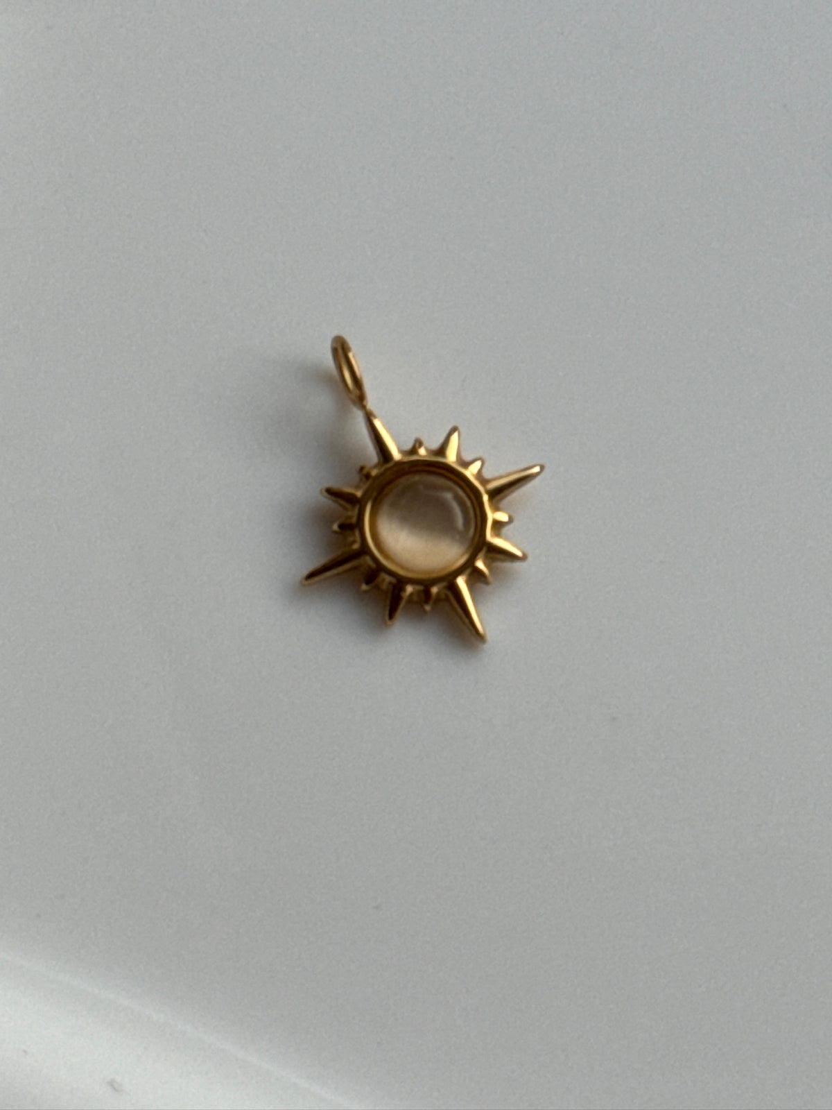 Cat Eye Sunburst Charm.