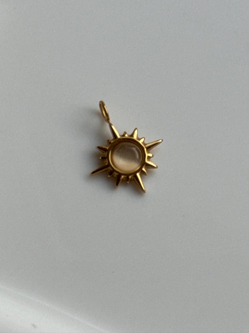 Cat Eye Sunburst Charm.
