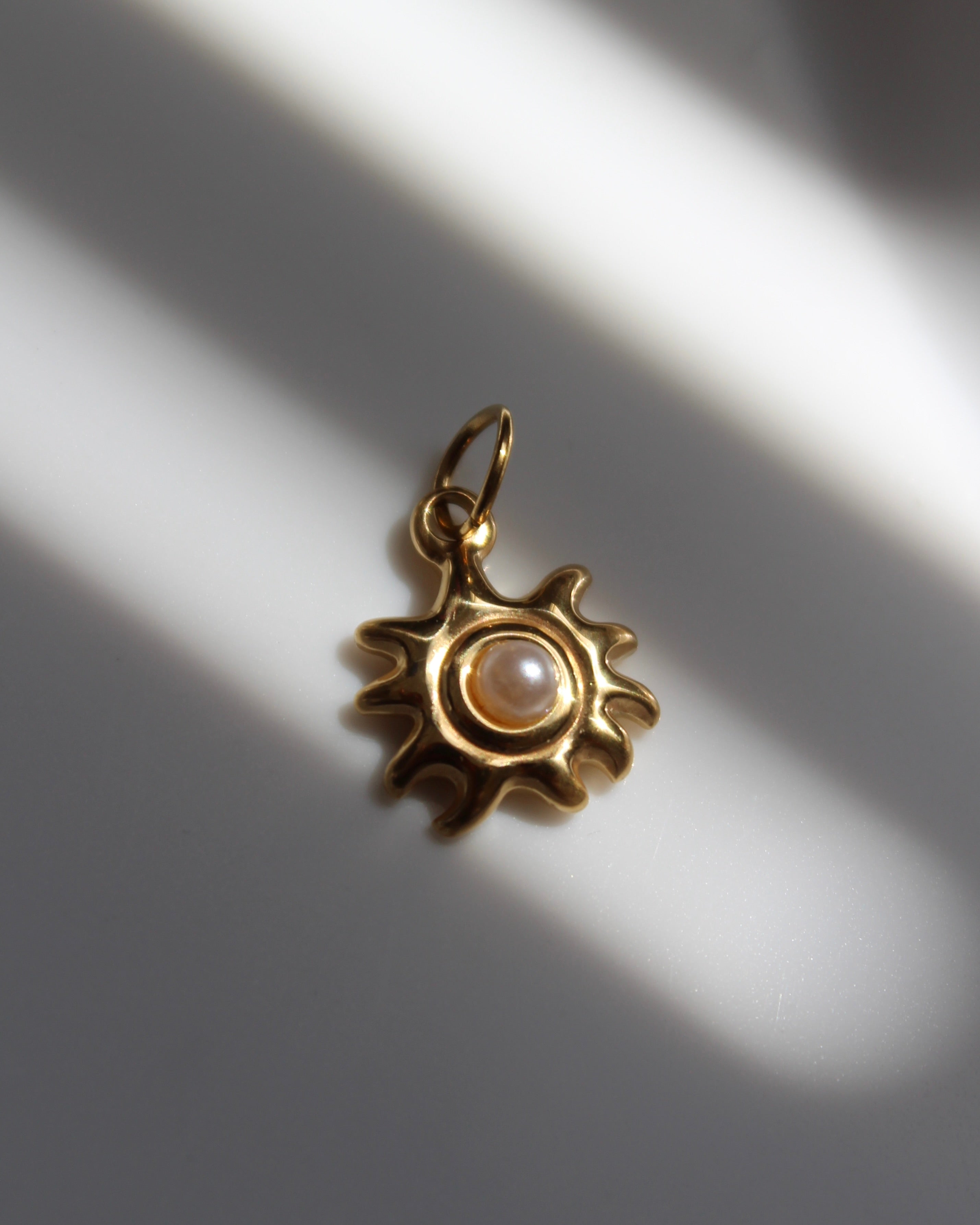Gold Pearl Sun Charm.