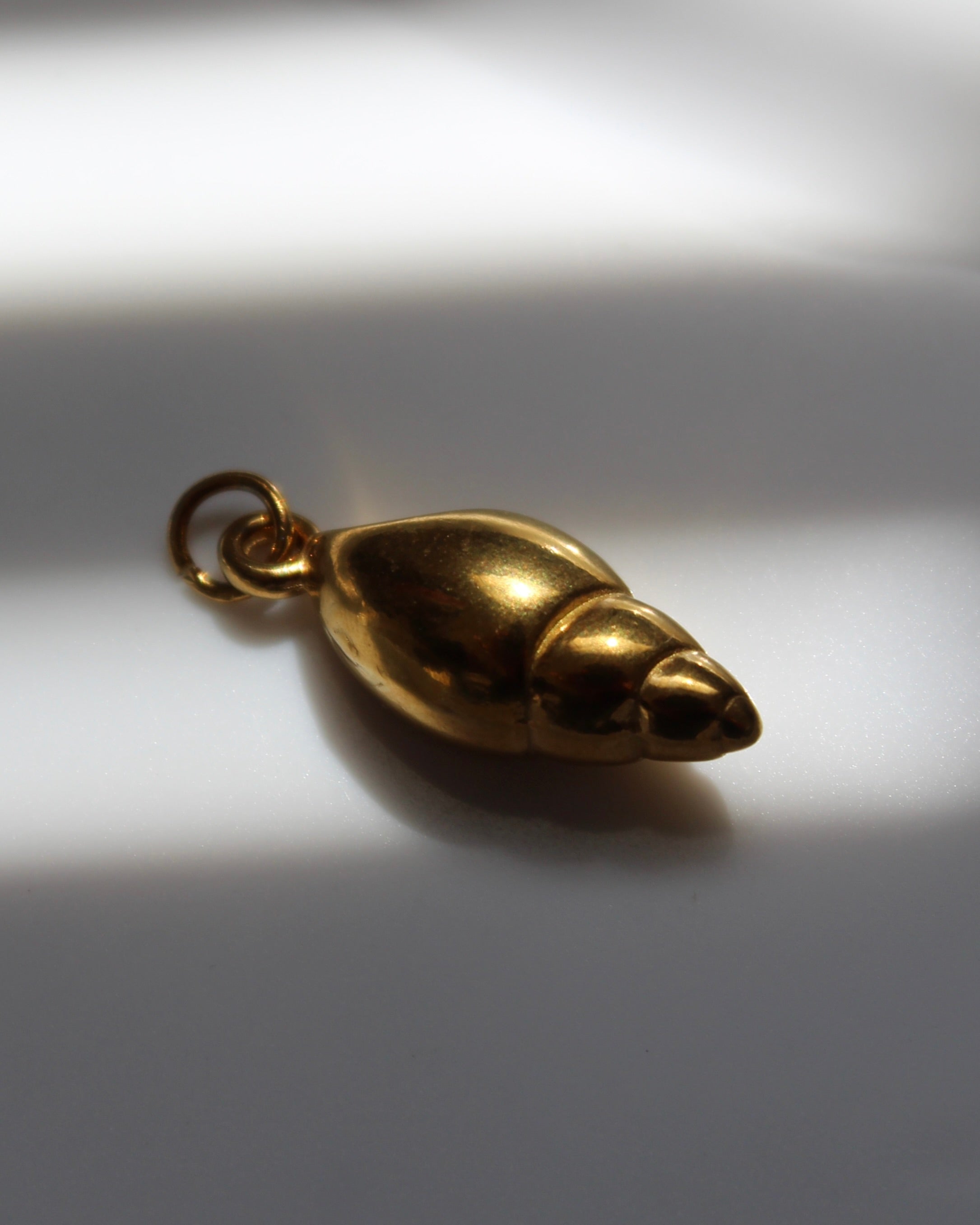Gold Conch Shell Charm.