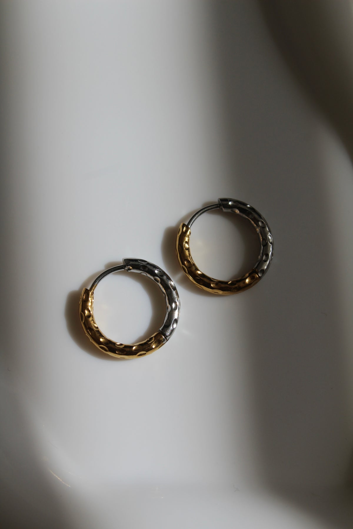 The Mixed Metal Hammered Harriet Slim Hoop Earrings.