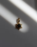 Gold Star Charm with Black Stone.