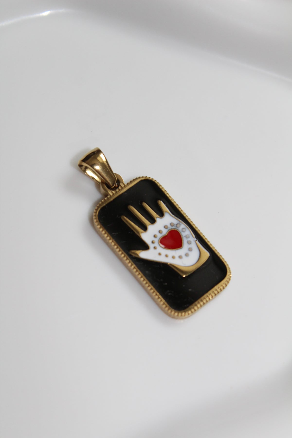 The Heart in Hand Charm.