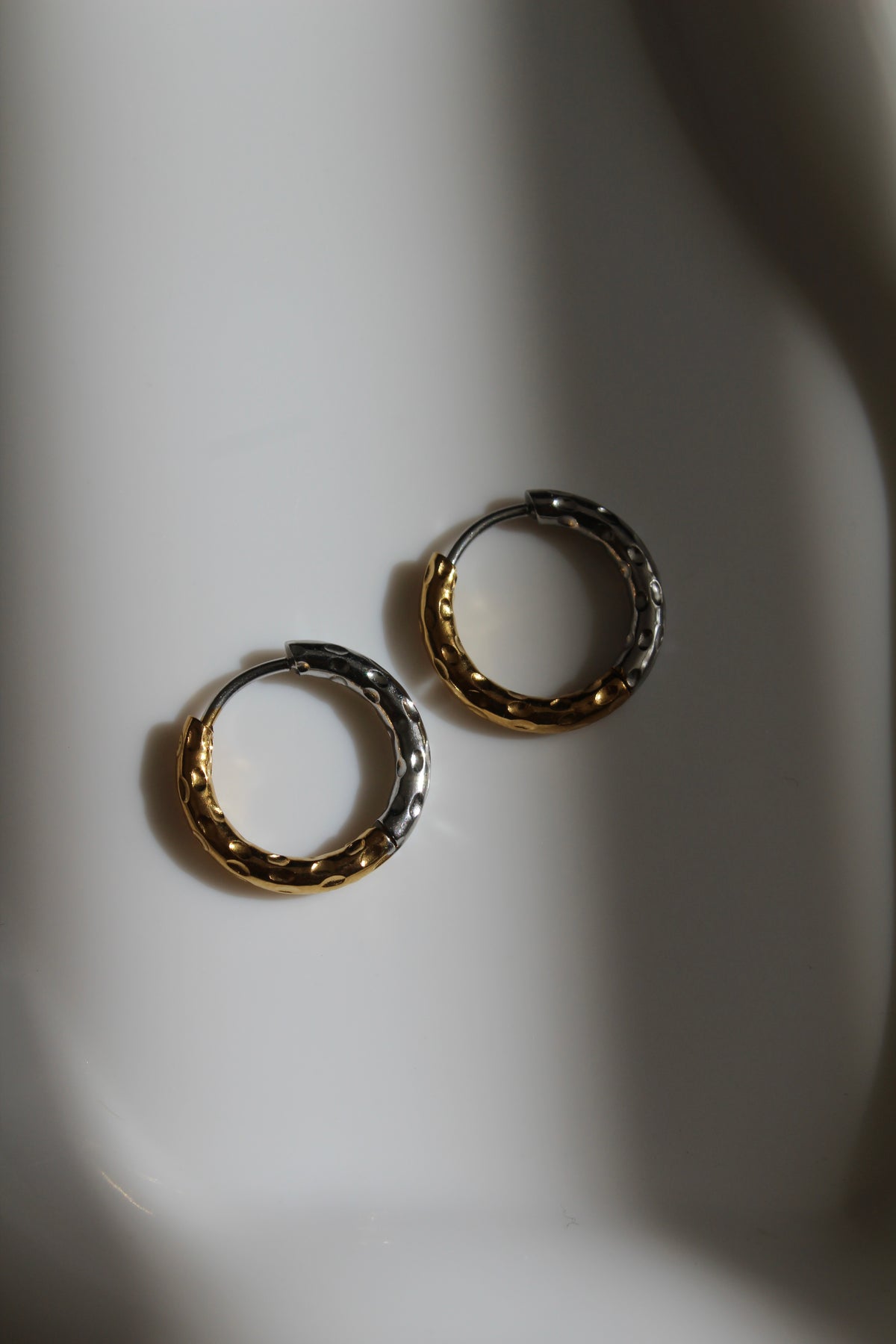 The Mixed Metal Hammered Harriet Slim Hoop Earrings.