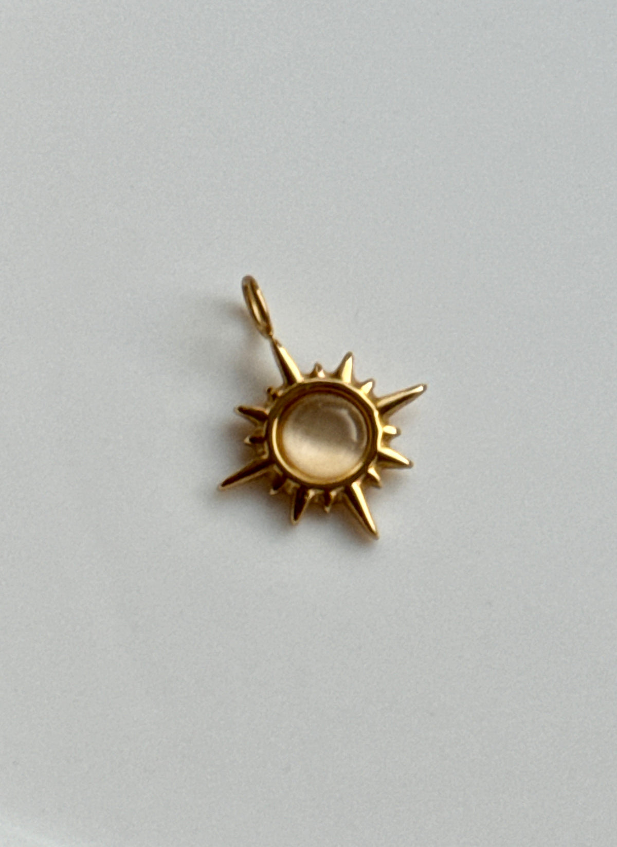 Cat Eye Sunburst Charm.