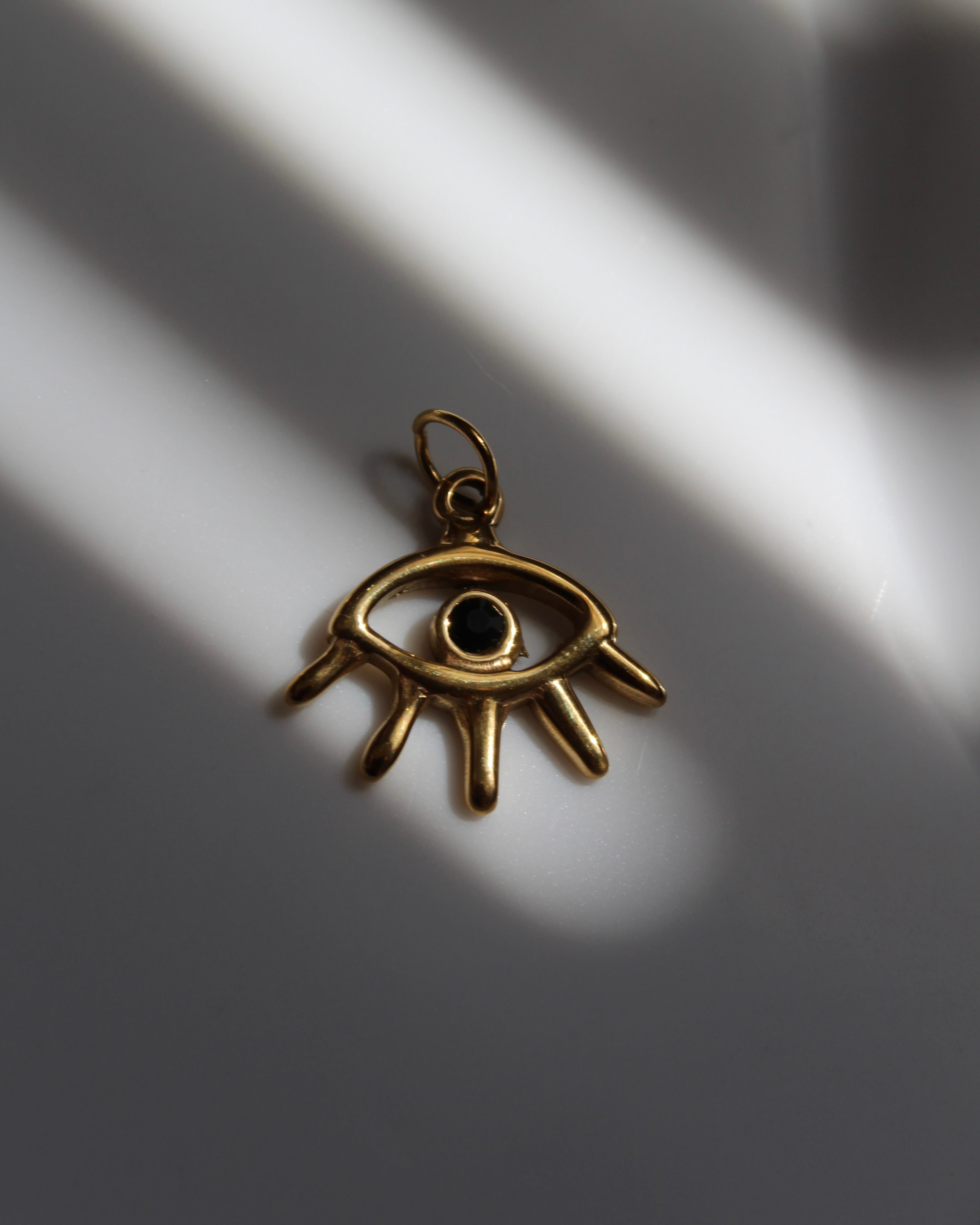 Eye Charm with Black Stone.