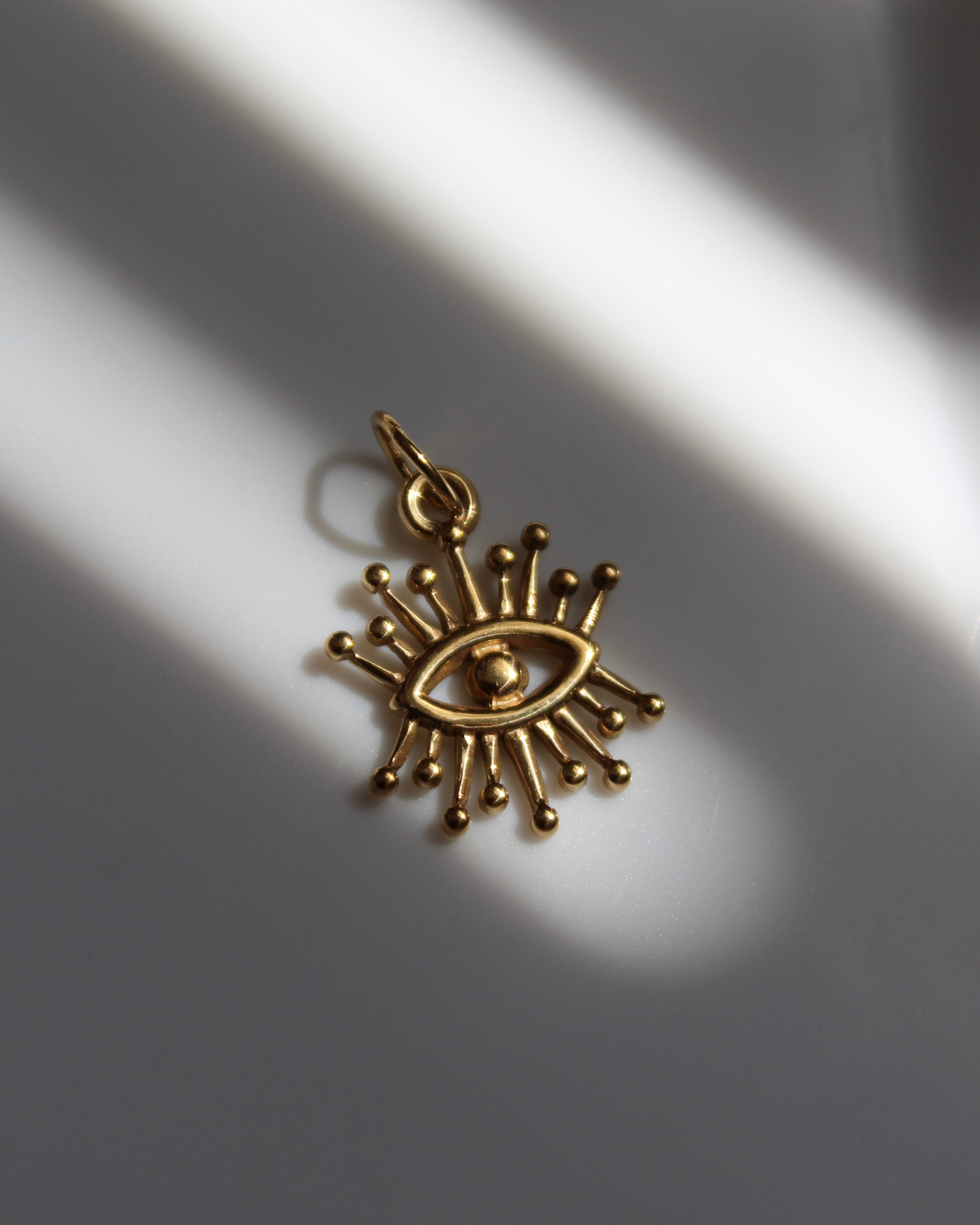 Abstract Gold Eye Dots Charm.