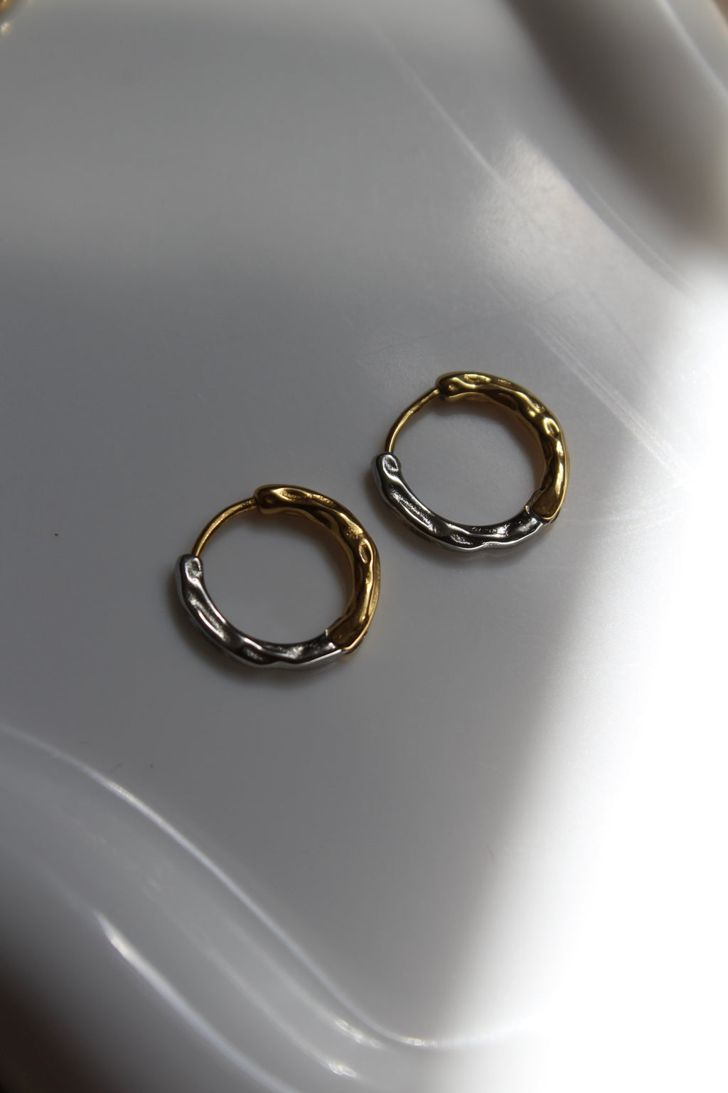 The Mixed Metal Hammered Harriet Hoop Mini Earrings.