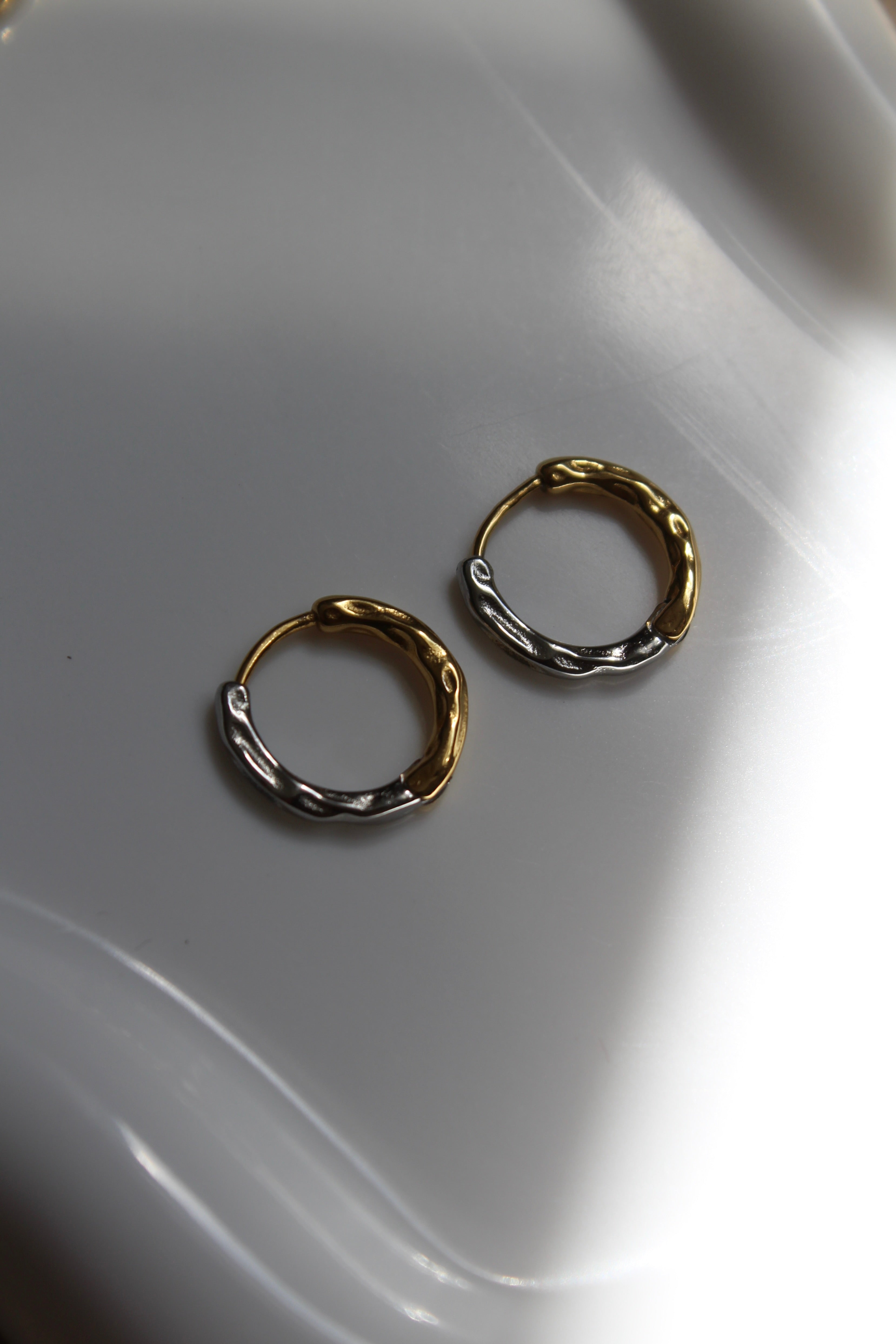 The Mixed Metal Hammered Harriet Hoop Mini Earrings.