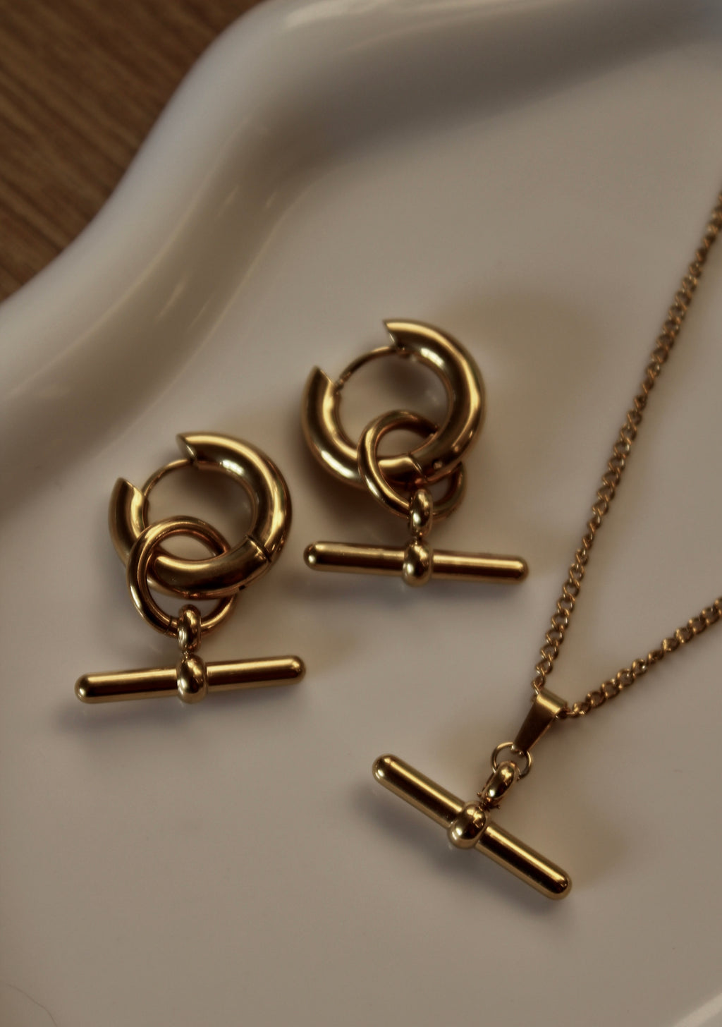 The Kelly T-Bar 18K Gold Hoop Earrings.