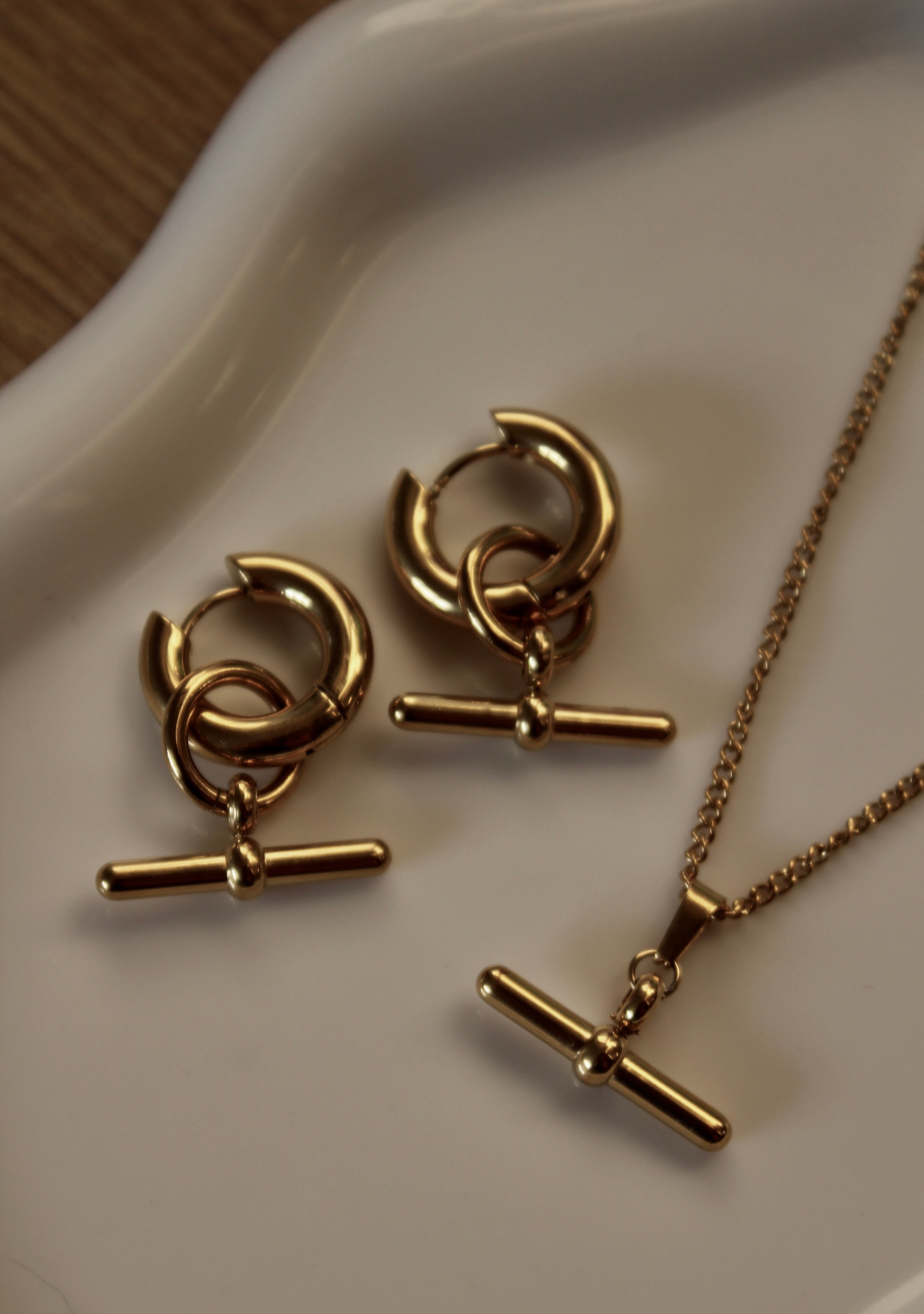 The Kelly T-Bar 18K Gold Hoop Earrings.