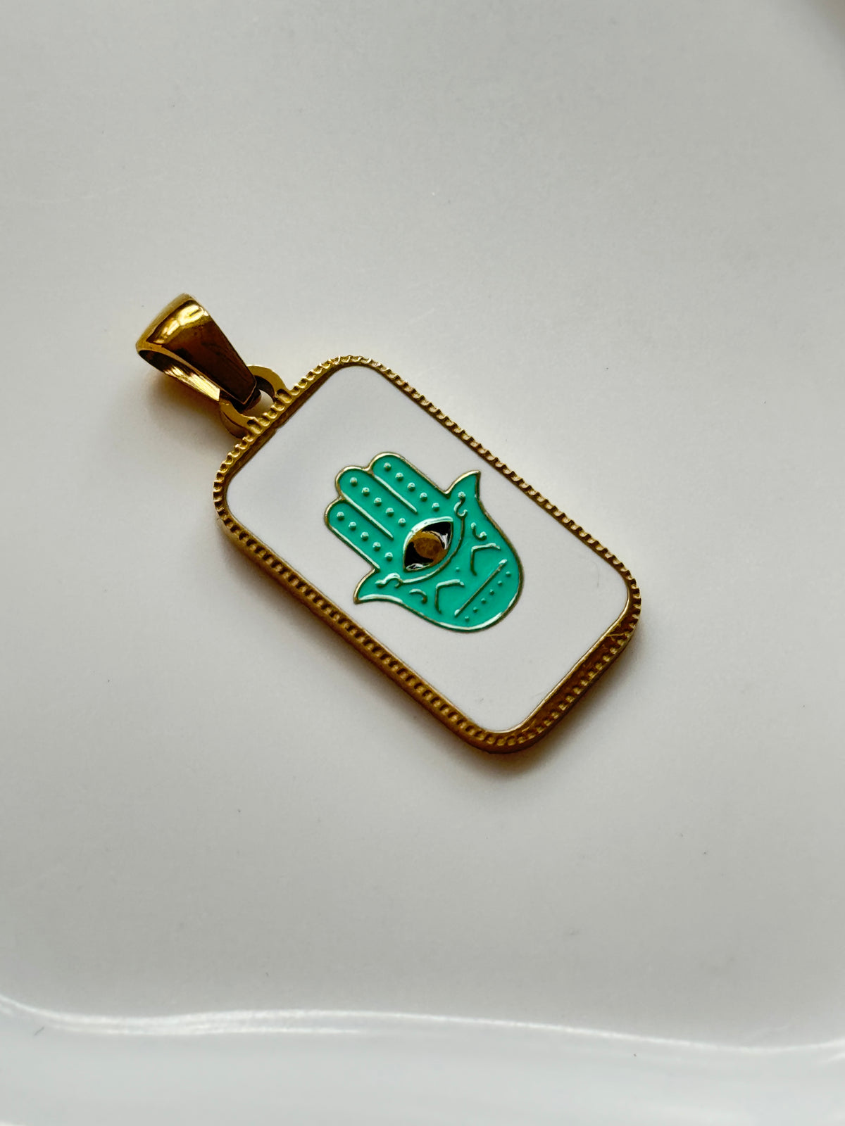 The Hamsa Hand Charm.