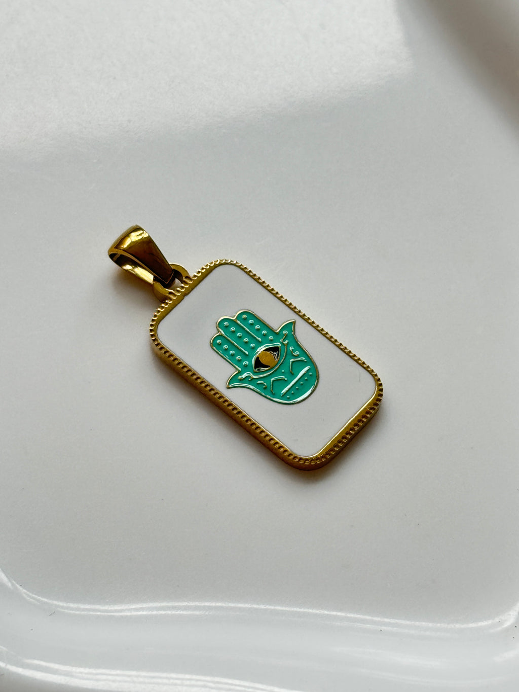 The Hamsa Hand Charm.