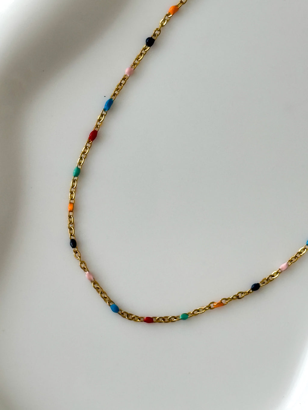 The Seren Confetti Sailor Charm Necklace.