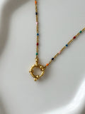 The Seren Confetti Sailor Charm Necklace.