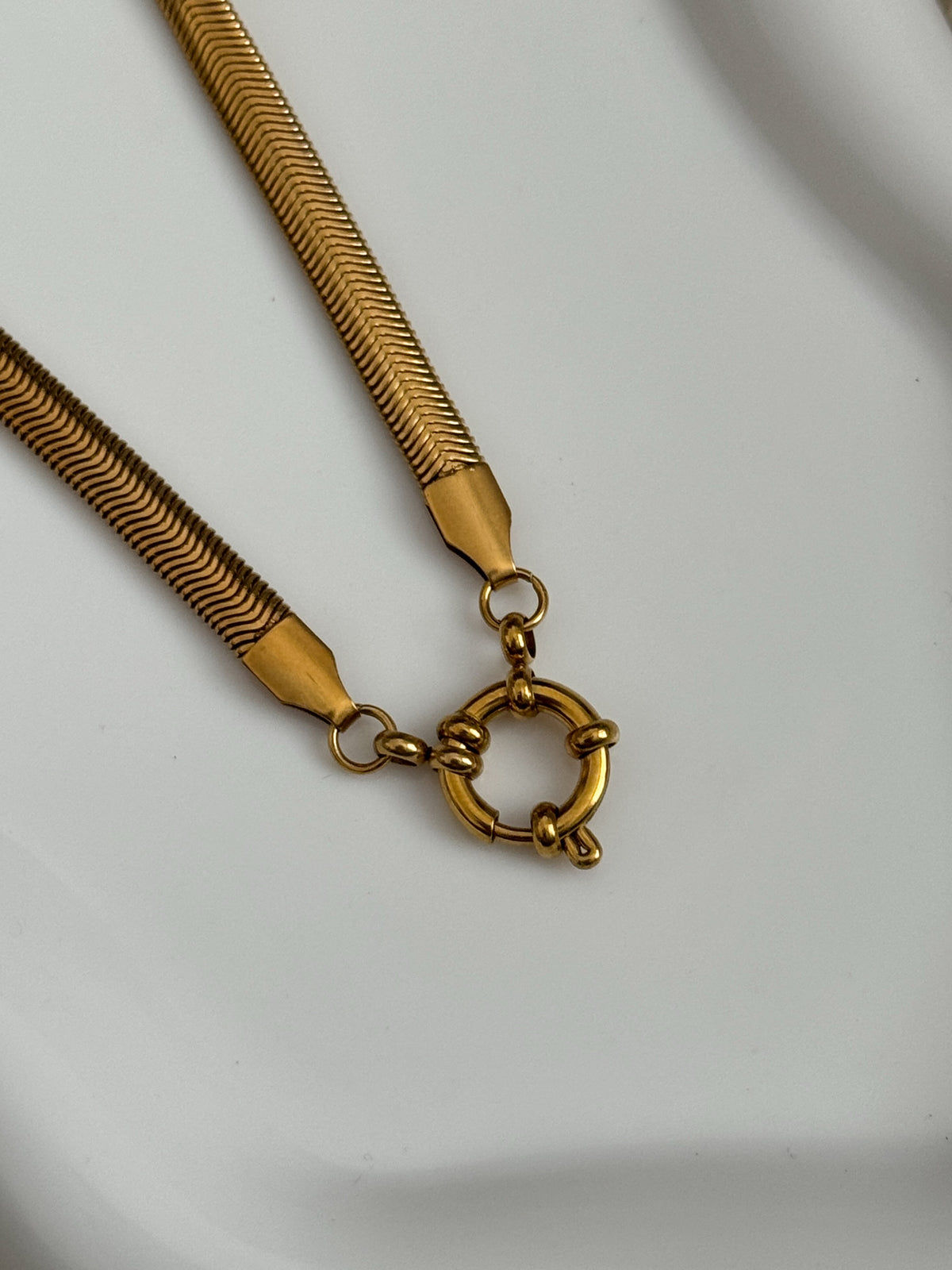 The Jenna 18K Gold Sailor Charm Snake Chain Necklace.